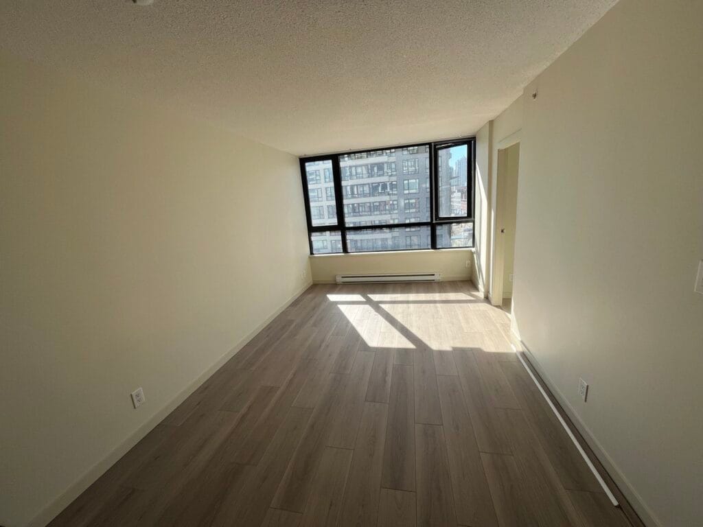 Grey-brown vinyl plank in a Yaletown condo bedroom