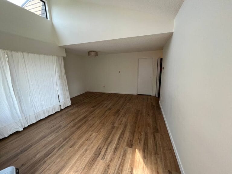 High-ceiling room with clerestory window and new flooring