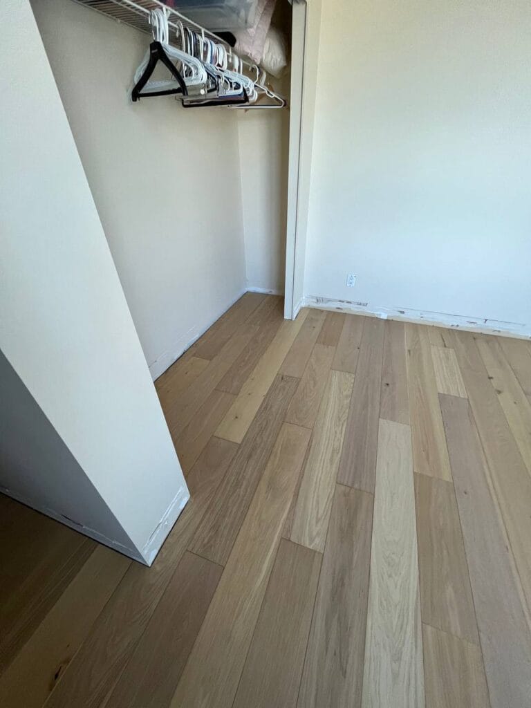 New plank flooring in a Marinaside Crescent condo bedroom