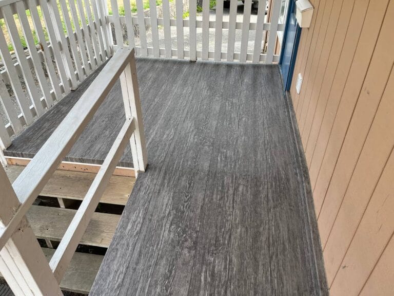 Covered deck resurfaced with grey vinyl decking