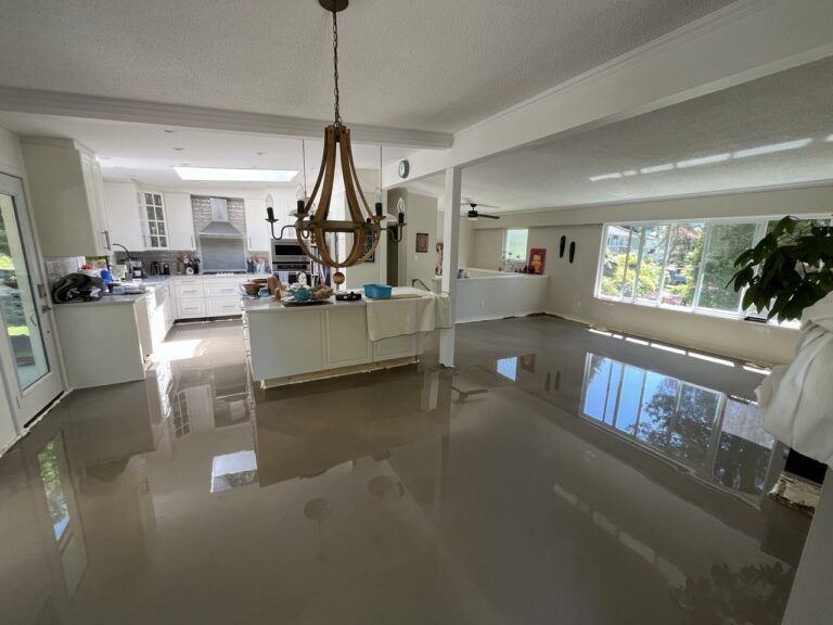 Kitchen and living space during renovation with self-levelling floor poured
