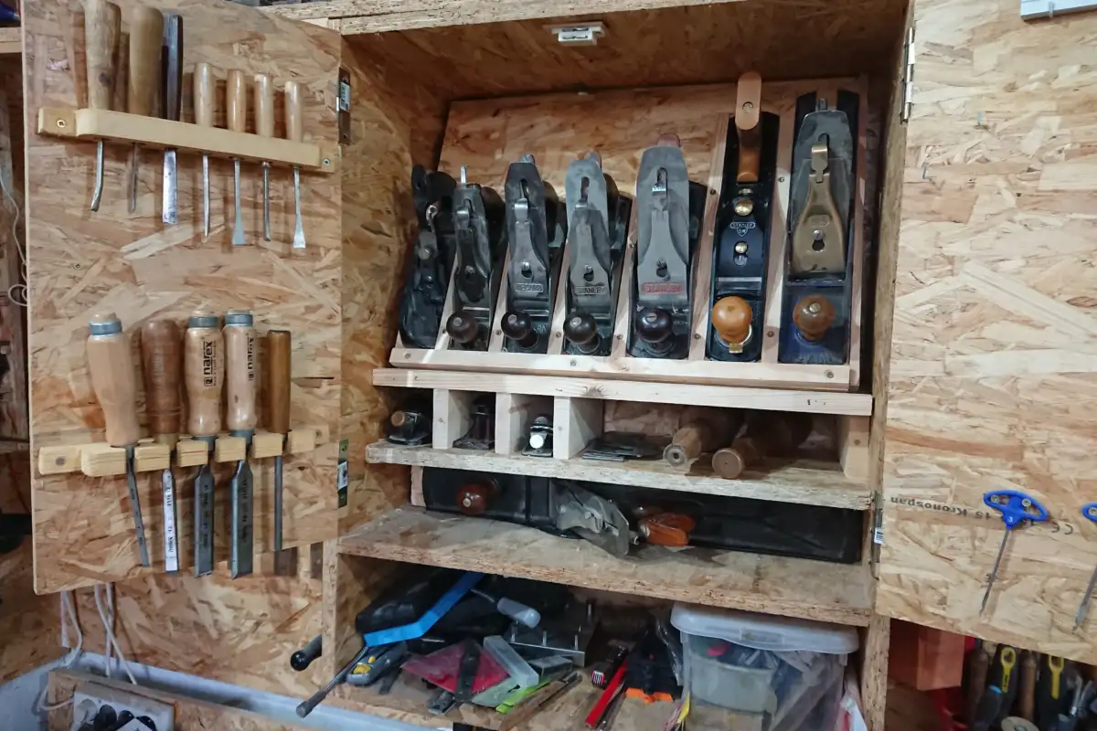 Woodworking tools organized inside a cabinet