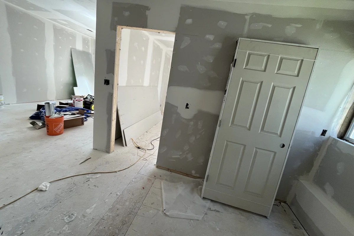 Basement renovation at the drywall taping stage with new interior walls