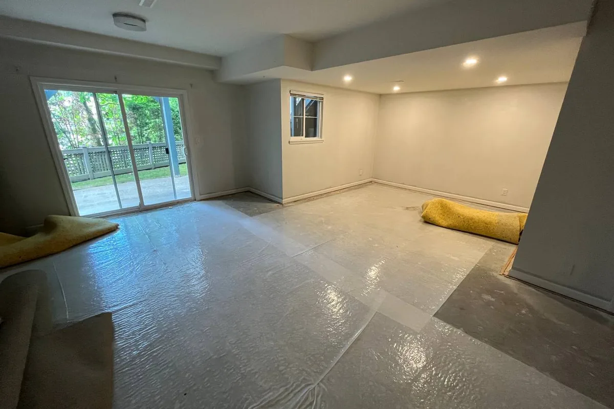 Walkout basement renovation with pot lights, new drywall and a sliding patio door