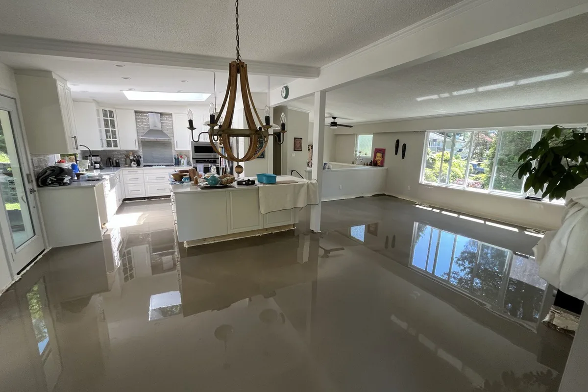 Open-plan main floor during a full renovation with freshly levelled floors