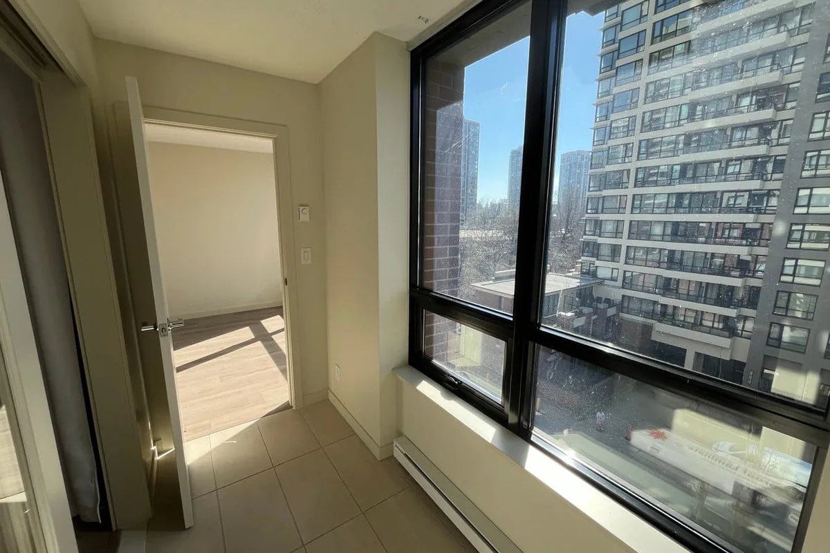 High-rise condo unit during a renovation, with neighbouring towers outside