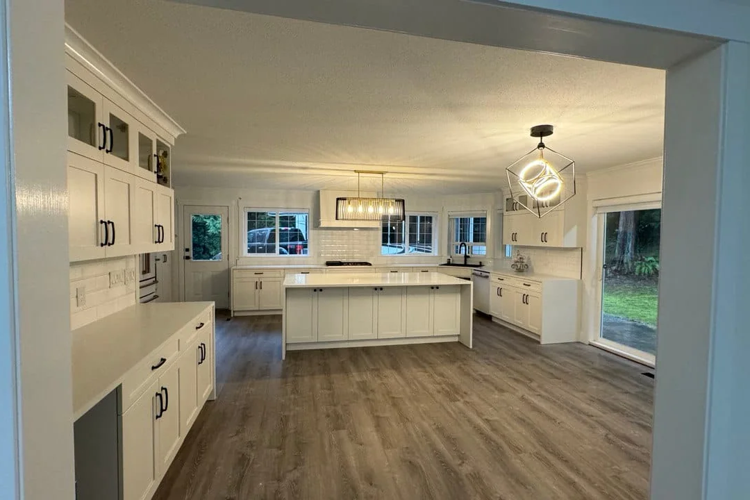 Whole-home renovation with a new open kitchen, island and flooring