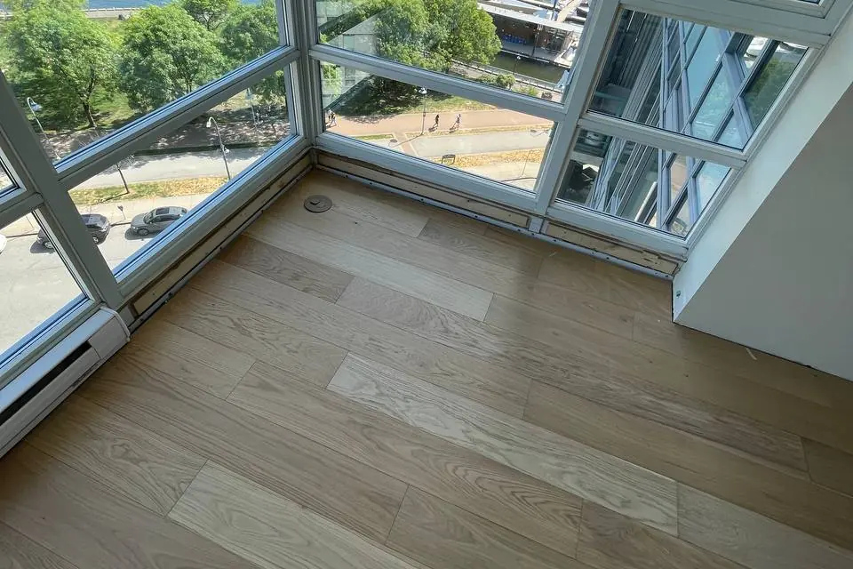 Wood floor in a waterfront Vancouver condo with large windows